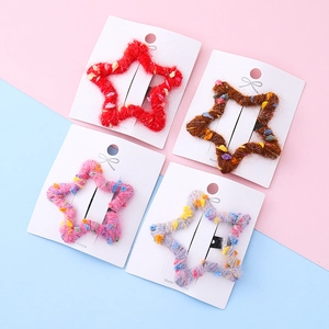 Lot de quatre barrettes étoiles au crochet colorées avec textures de laine