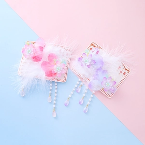 Chinese style hair clips for girls featuring floral resin, soft feathers, and pearl tassels