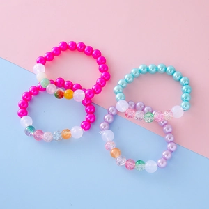 Colorful four-piece beaded bracelet set for girls with pastel resin pearls and charms
