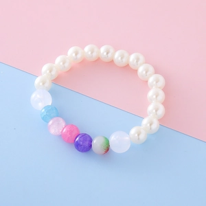 Cute girl's beaded bracelet with white faux pearls and colorful cracked macaron beads