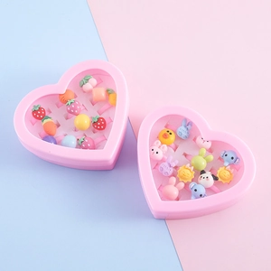 Set of two pink heart-shaped boxes filled with colorful resin cartoon rings for children