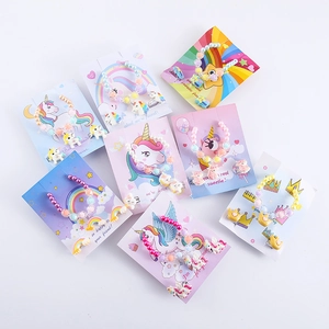 Kids jewelry set with colorful unicorn resin beads bracelet and matching ring on card