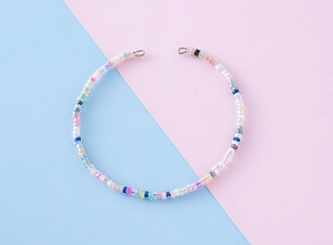 Detail of colorful handmade seed bead jewelry strand with vibrant candy-colored glass beads