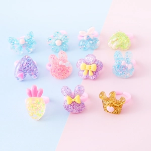 Set di 11 anelli colorati in resina glitterata per bambine con forme assortite