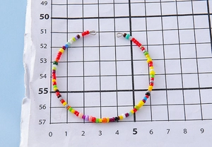 Macro view of handmade colorful beaded jewelry with vibrant round beads and metal rings