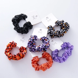 Set of 6 Halloween hair scrunchies with sequins and pumpkin bat patterns on cards