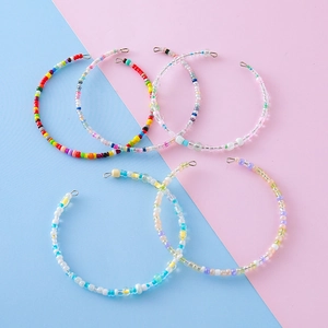 Colorful handmade seed bead bracelet rings in rainbow and pastel styles with metal clasps