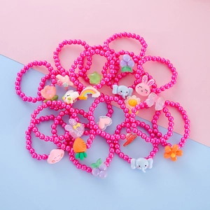 Detailed close-up of colorful resin beads and cute cartoon animal charms for kids
