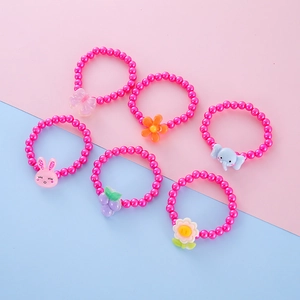 Close-up of a 6-piece colorful beaded children's bracelet set with cute resin animals