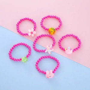 Close-up of 6-piece beaded bracelets with cute bunny, flower, and sun resin charms