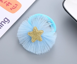 Macro shot of light blue mesh hair tie with sparkling gold sequin star detail for girls