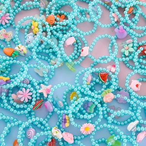 Kids cute blue beaded bracelets with cartoon charms like flowers, rabbits and unicorns