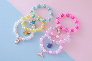 Detailed view of colorful beaded bracelets set for girls with cute sea charms