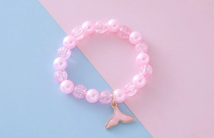 Pink faux pearl bracelet with cracked beads and enamel mermaid tail charm for girls