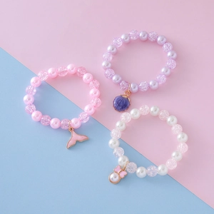 Girl's pearl and crackle bead bracelet set with seahorse and seashell pendants