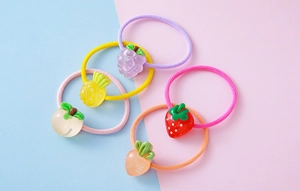 Set of 5 elastic hair ties with colorful resin fruit charms like strawberry and grape