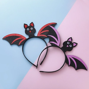 Halloween bat wing headbands with glitter finish and wiggle eyes for party decorations