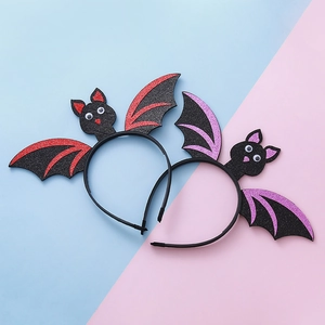 Halloween bat wing headbands in red and purple glitter finish for festive party costumes