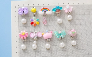 Detailed set of 10 clip-on earrings for kids with cartoon resin charms and pearls