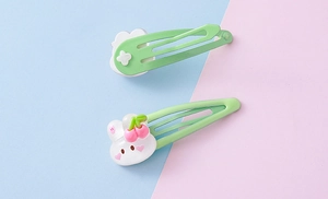 Detail of green strawberry bunny BB clips for kids with cute resin clouds and rabbit charms