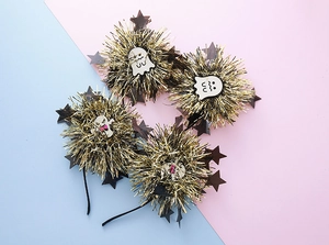 Set of four Halloween headbands featuring golden tinsel balls and cute white ghost motifs