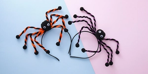Detail of Halloween spider headbands with plush legs and large eyes for party costumes