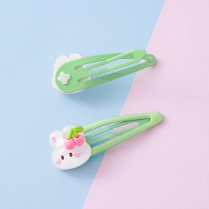 Cute green strawberry bunny hair clips for kids with cloud and rabbit charms on pink blue base