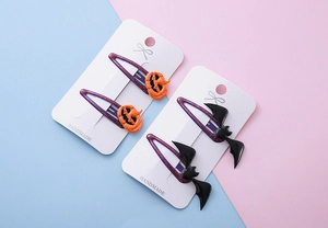 Lot de 4 barrettes d'Halloween avec citrouilles orange et chauves-souris noires