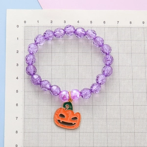 Beaded Halloween pumpkin charm bracelet with purple transparent faceted beads for girls