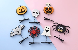 Detailed set of 7 Halloween hair clips featuring pumpkin, ghost, and bat spring designs