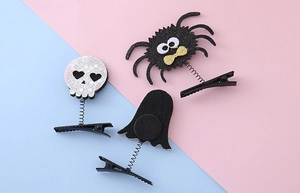 Detail of Halloween hair clips with glitter spider, skull and ghost on bouncy springs