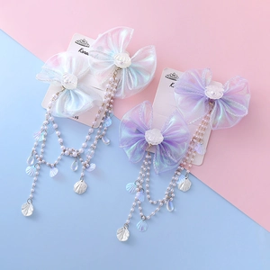 Kids mermaid pearl tassel bow hair clips with iridescent fabric and seashell pendants