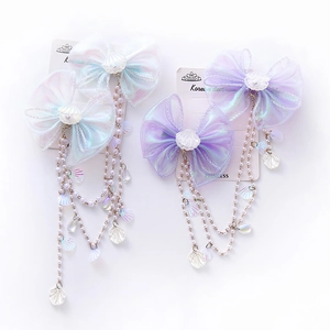 Kids mermaid pearl bow hair clips with shell tassels and shimmering mesh in white and purple