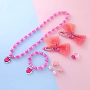 Pink heart and bow accessory set with pearl necklace, bracelet, and cute clips for girls