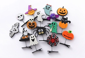 Detailed set of Halloween hair clips featuring glittery pumpkins ghosts and bats on springs