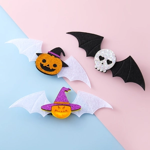 Clips de pelo de Halloween con calabazas brillantes y calaveras con alas de murciélago