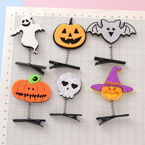 Creative Halloween hair clip set featuring spring-mounted ghosts, pumpkins, and bats elements