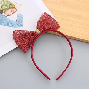Detail of red glitter mesh bow headband for girls featuring a golden center decorative wire