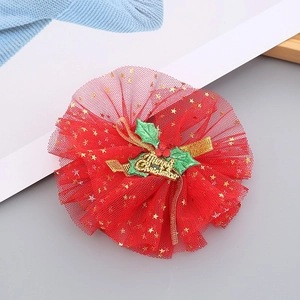 Detail of a Christmas red mesh headband with gold Merry Christmas text and sequins