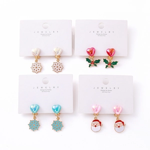 Christmas themed earring set with 925 silver posts featuring Santa and snowflake designs
