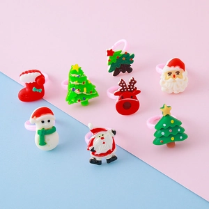 Colorful resin Christmas rings set for kids featuring Santa Claus, reindeer and tree