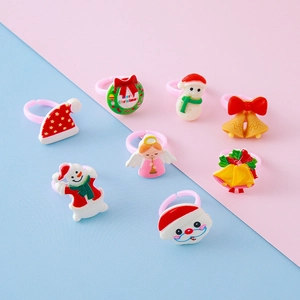 Christmas resin ring set with Santa, snowman and bells on adjustable pink bands