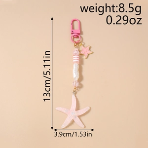 Pink starfish keychain with striped beads and size dimensions shown on pink background