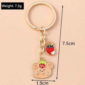 Detailed close-up showing the 7.5cm strawberry bear keychain dimensions and metallic ring