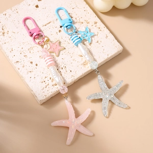 Fashionable ocean theme keychain with starfish pendant and striped beads in pink and blue