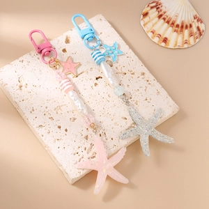 Fashion stripe beaded starfish keychain set for bags featuring pink and blue glitter charms