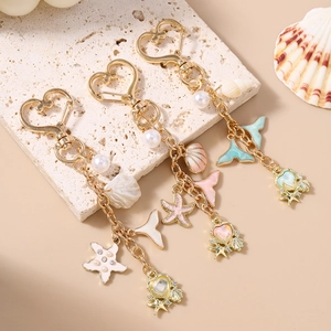 Fashionable ocean theme keychain with starfish shell pearls and heart hook in three colors