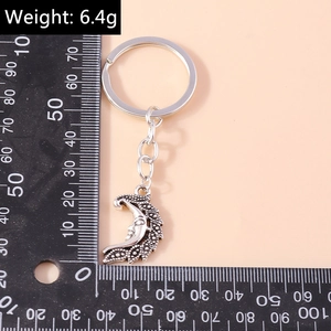 Vintage silver moon face keychain with celestial pendant and flat ring, 6.4g weight