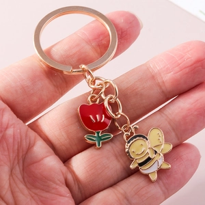 Eleganter Gold-Schlüsselanhänger mit roter Tulpe und Bienen-Anhängern für Handtaschen
