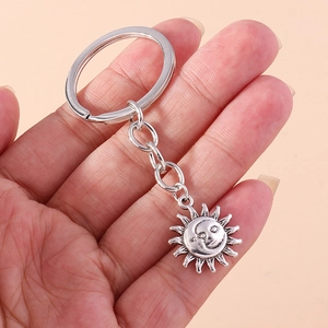 Retro silver moon and sun keychain with personified celestial design for bags